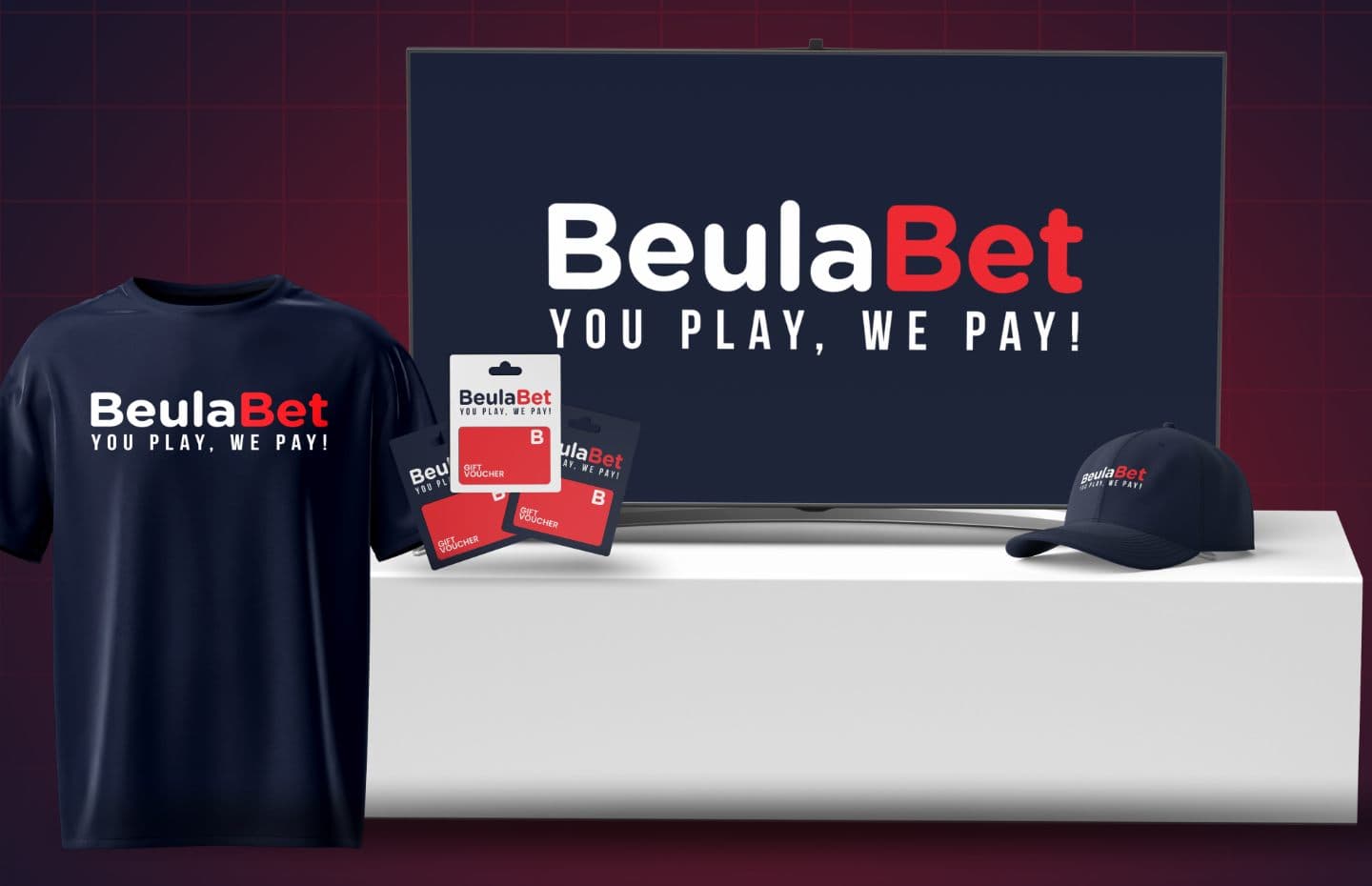 The Beula Champions prizes: a branded tee, cap and gift vouchers beside a brand-new television.